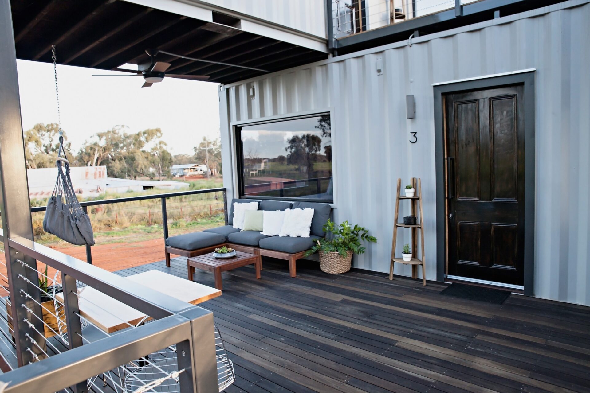 Sky Suite at Callubri Station featuring outdoor balcony with lounge seating and outback views.