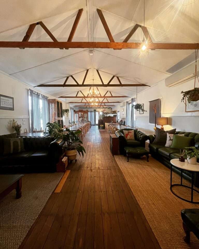 Converted shearer's quarters at Callubri Station features exposed timber beams and lounge seating.