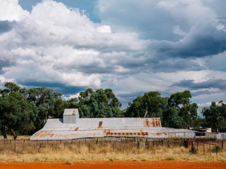 Historic shearer's quarters with corrugated iron roof in Central West NSW outback landscape.